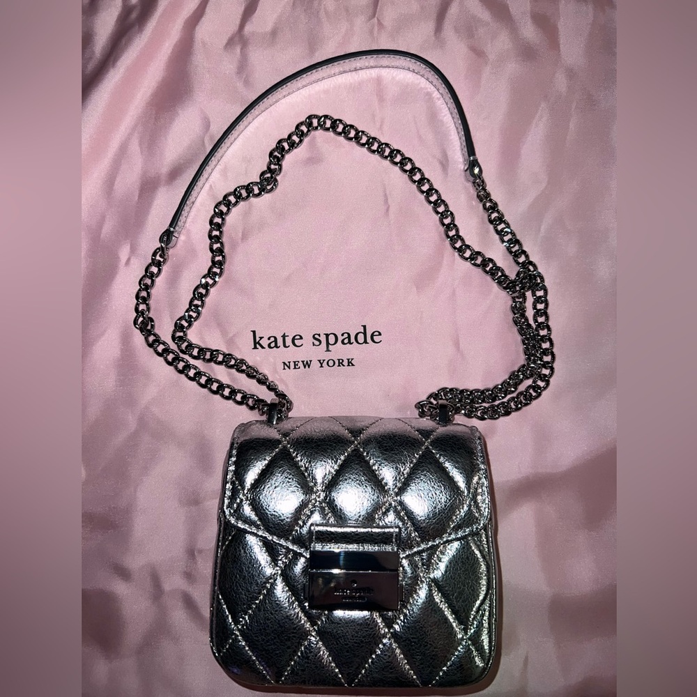 KATE SPADE CAREY METALLIC MICRO FLAP CROSSBODY
Color: Lunar Light